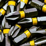 Detailed image of steel screwdriver bits with yellow bands.