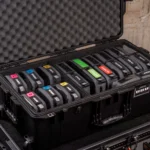 Color-coded equipment bags neatly arranged in a durable hard case.