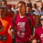 Diverse group of runners in a competitive marathon event wearing sportswear.